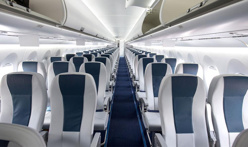 Rows of adjustable aircraft seating in blue and white