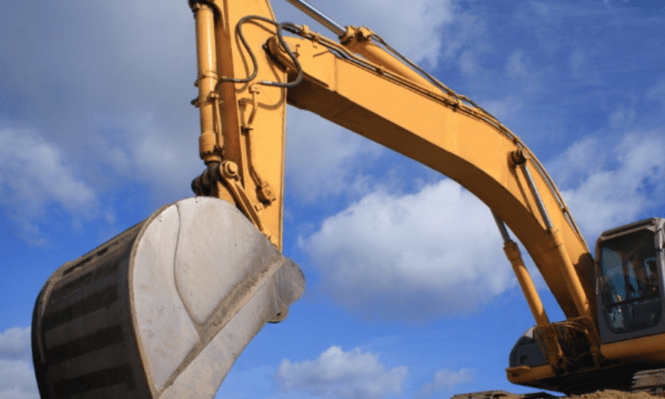 Construction vehicle digging arm using safety locking gas strut with shroud
