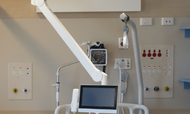 Hospital monitor arms using friction locking compression gas struts
