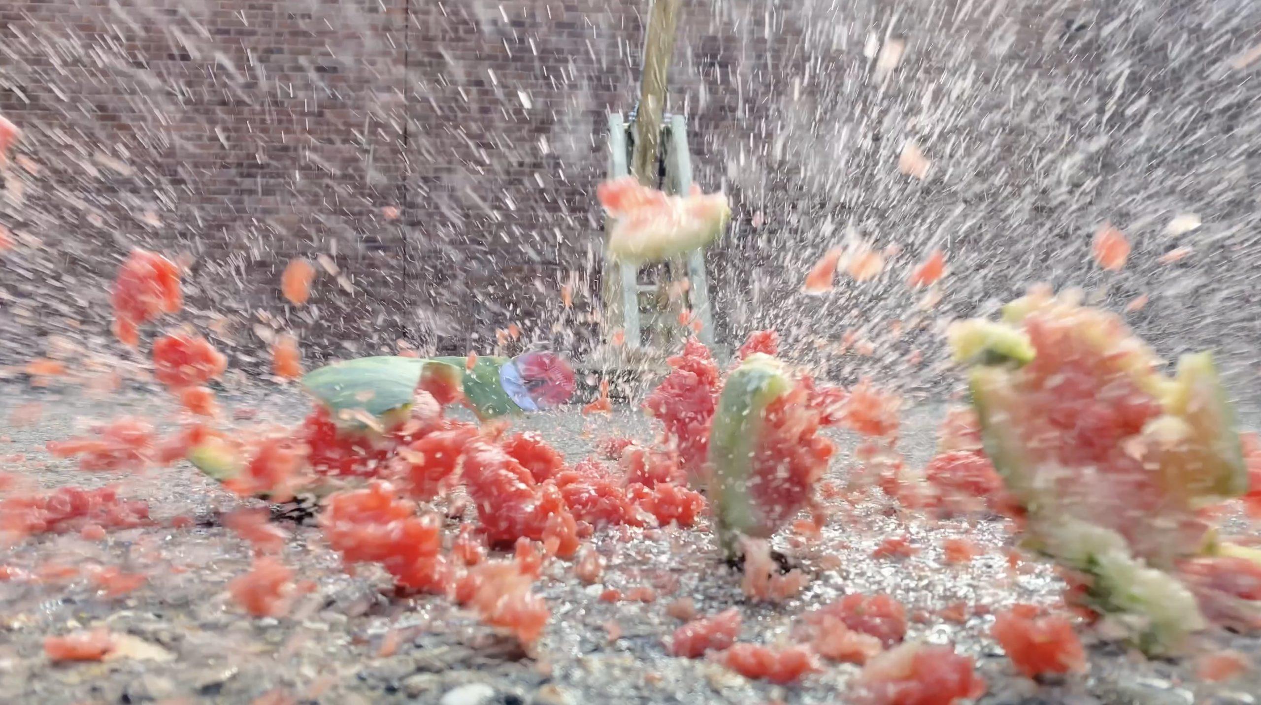 A close up shot of an exploding watermelon